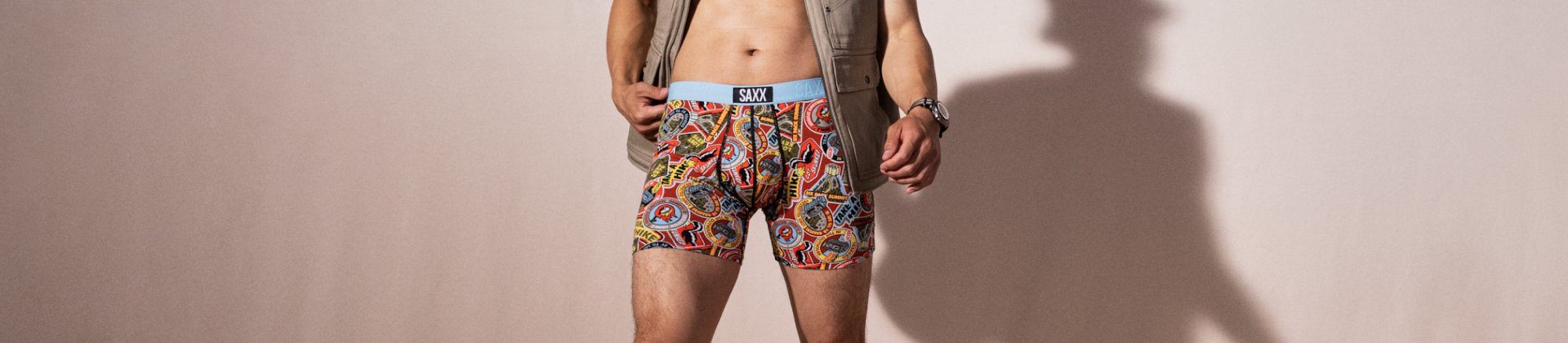 Man standing in colorful Ultra underwear and vest