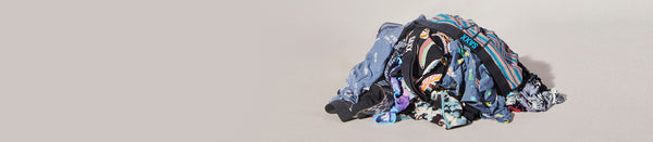 Pile of underwear in different colors and patterns on grey backdrop