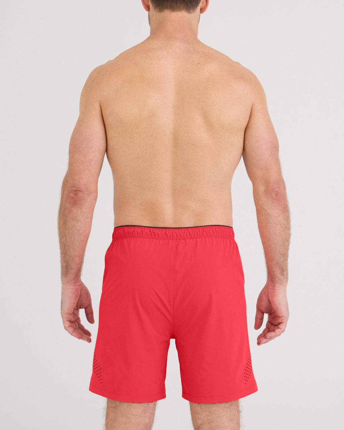Back - Model wearing Power Moves Short 7" in Coral Red