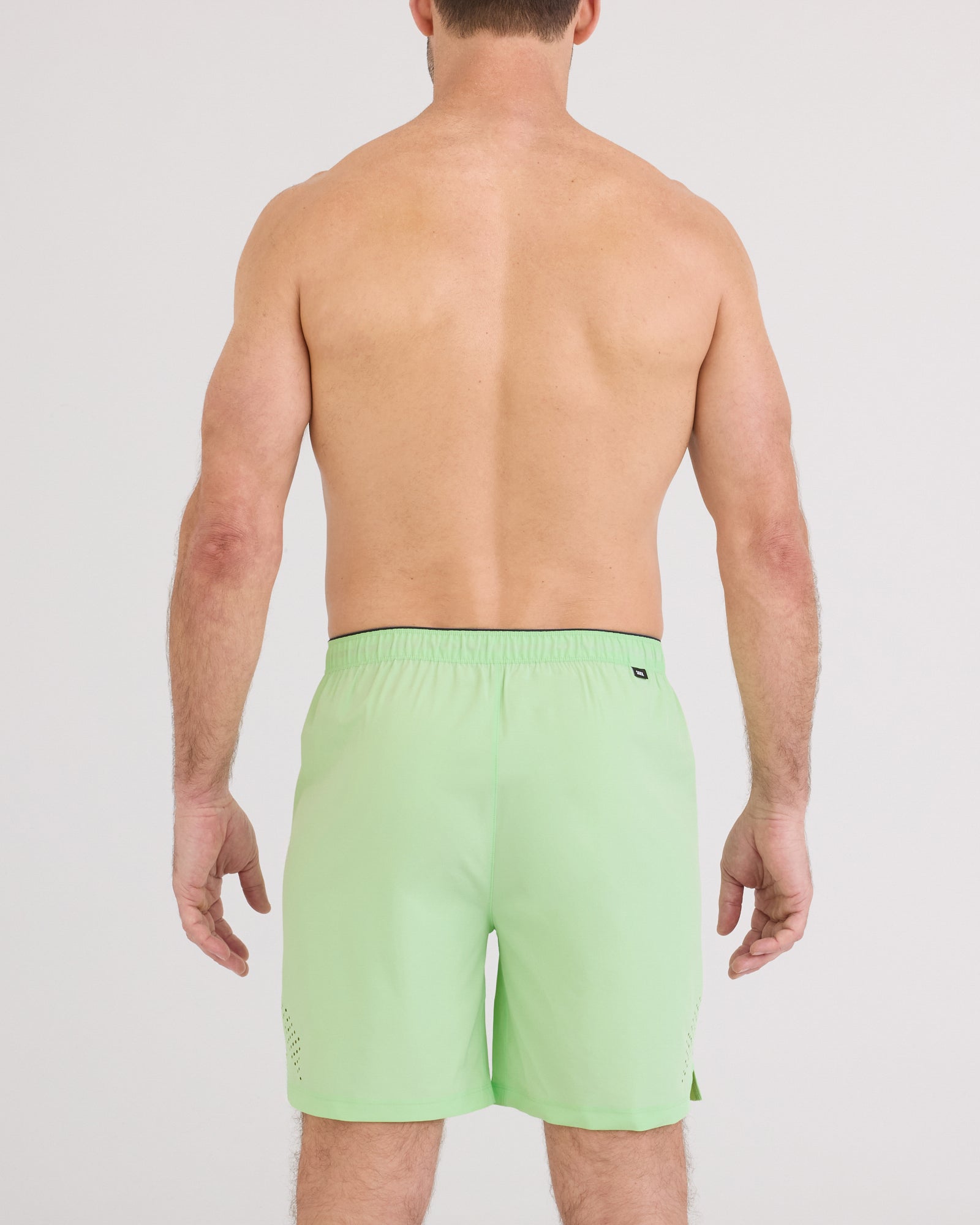 Back - Model wearing Power Moves Short 7" in Patina Green