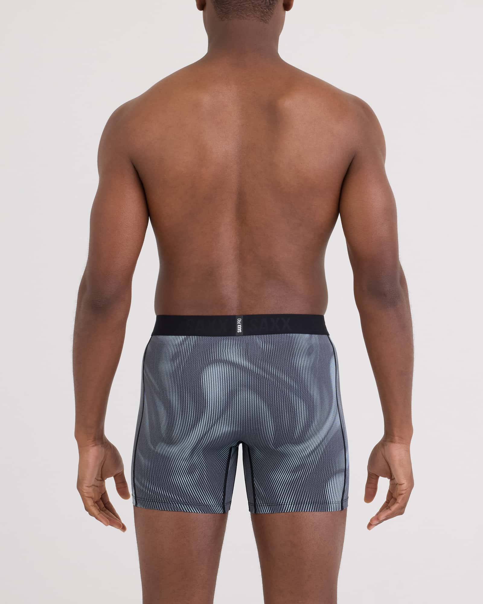 Back - Model wearing Smooth Flex Light Compression Boxer Brief in Smoke Camo-Deep Navy