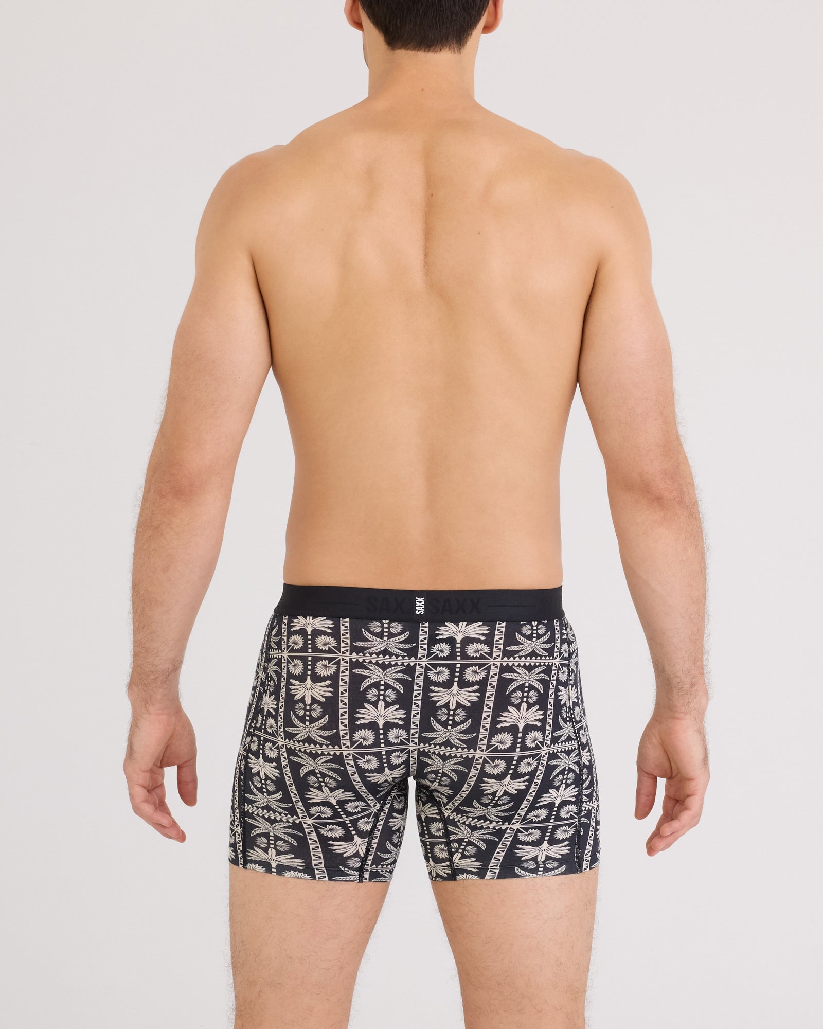 Back - Model wearing Smooth Luxe Micro Modal Boxer Brief in Tropic Royale-Black