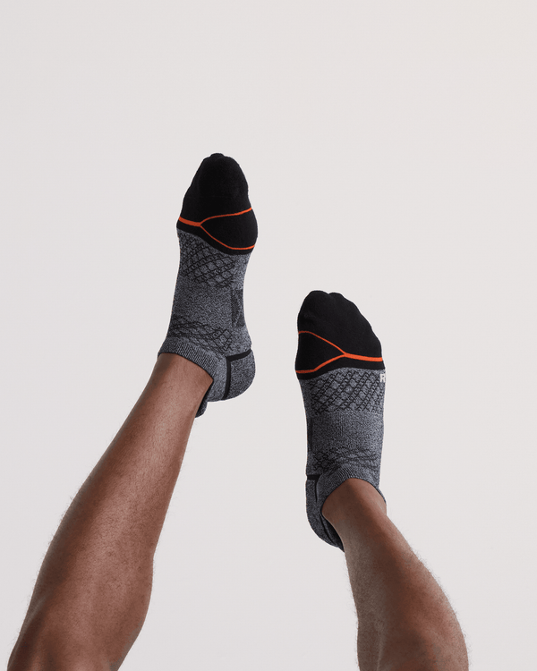 Back - Model wearing  Foot Hold Mid-Weight Low Show Sock in Black/White