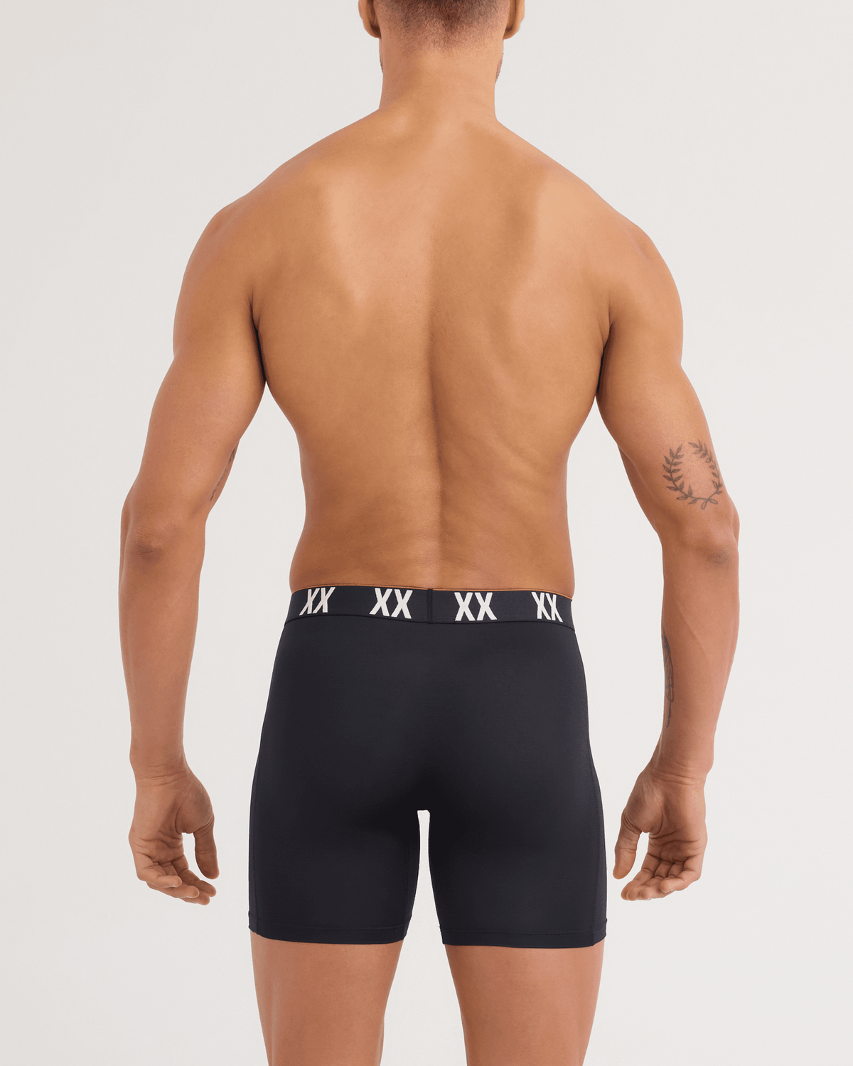 Back - Model wearing Multi-Sport Mesh Boxer Brief in Black/XX Waistband