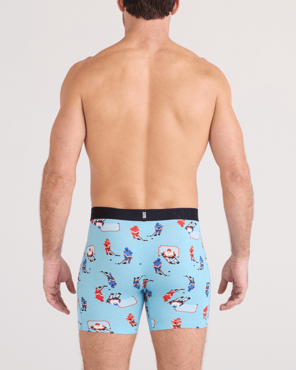 Back - Model wearing DropTemp Cooling Cotton Boxer Brief Fly in Action On Ice-Blue Tide