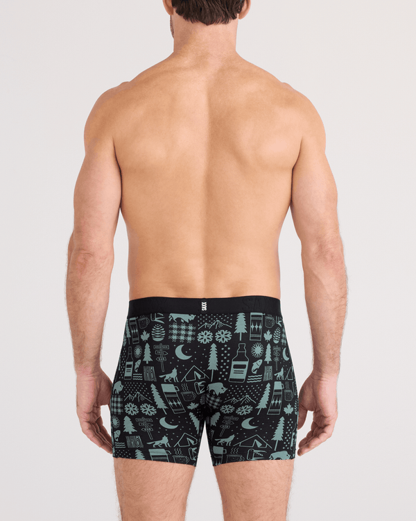 Back - Model wearing DropTemp Cooling Cotton Boxer Brief Fly in Camp Stamps-Black
