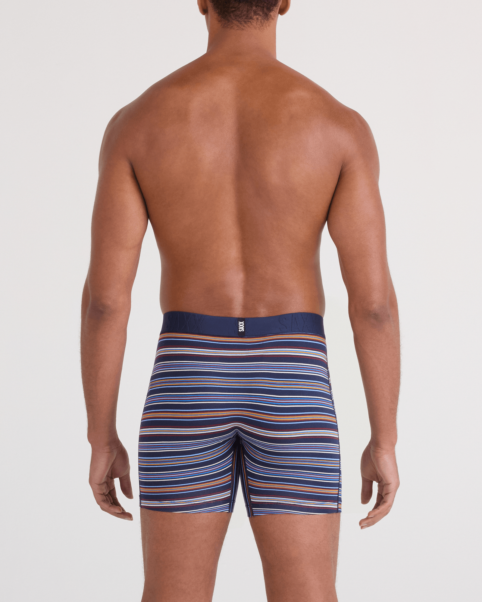 Back - Model wearing Droptemp Cooling Cotton Boxer Brief Fly in Vivid Stripe