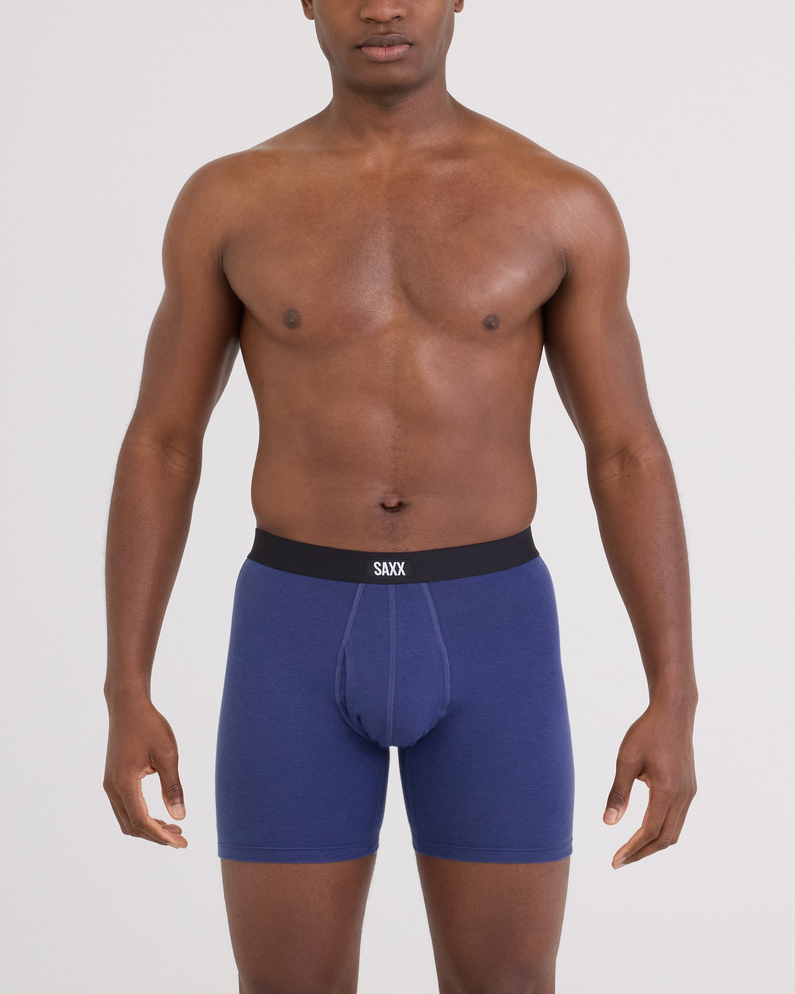 Front - Model posing in Core Cotton Boxer Brief in Deep Cobalt