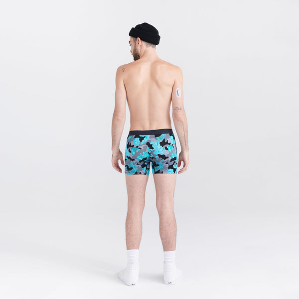 Back - Model wearing Vibe Super Soft Boxer Brief in Island Camo- Black