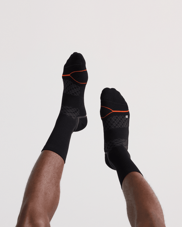 Back - Model wearing  Foot Hold Mid-Weight Crew Sock in Black