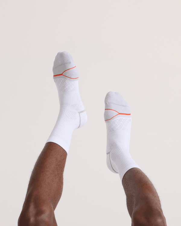 Back - Model wearing Foot Hold Mid-Weight Crew Sock in White