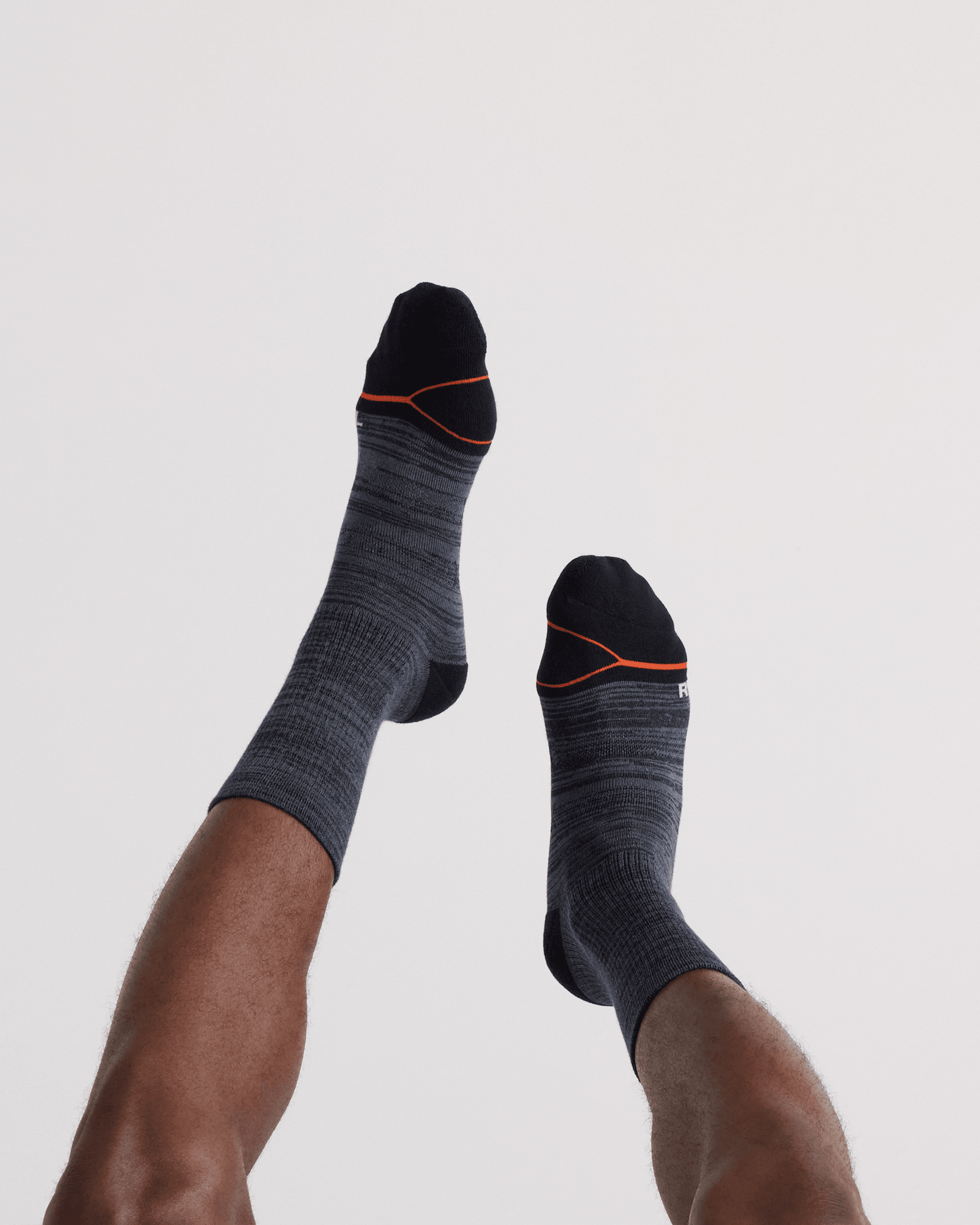 Back - Model wearing Good Form Crew Sock in Black/Grey Stripe