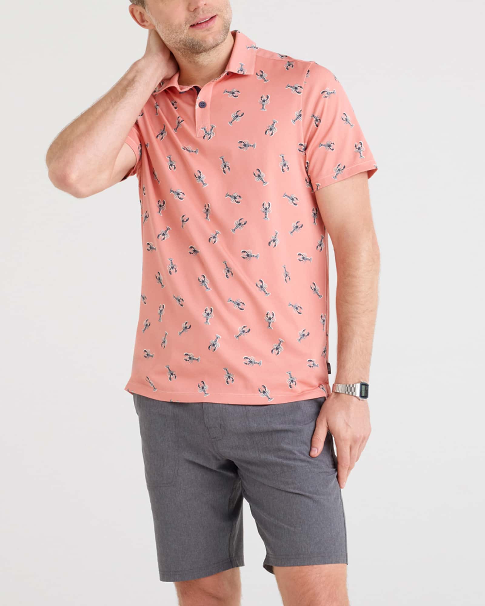 Front - Model wearing Droptemp Dry Polo in Lobster Boil-Burnt Coral