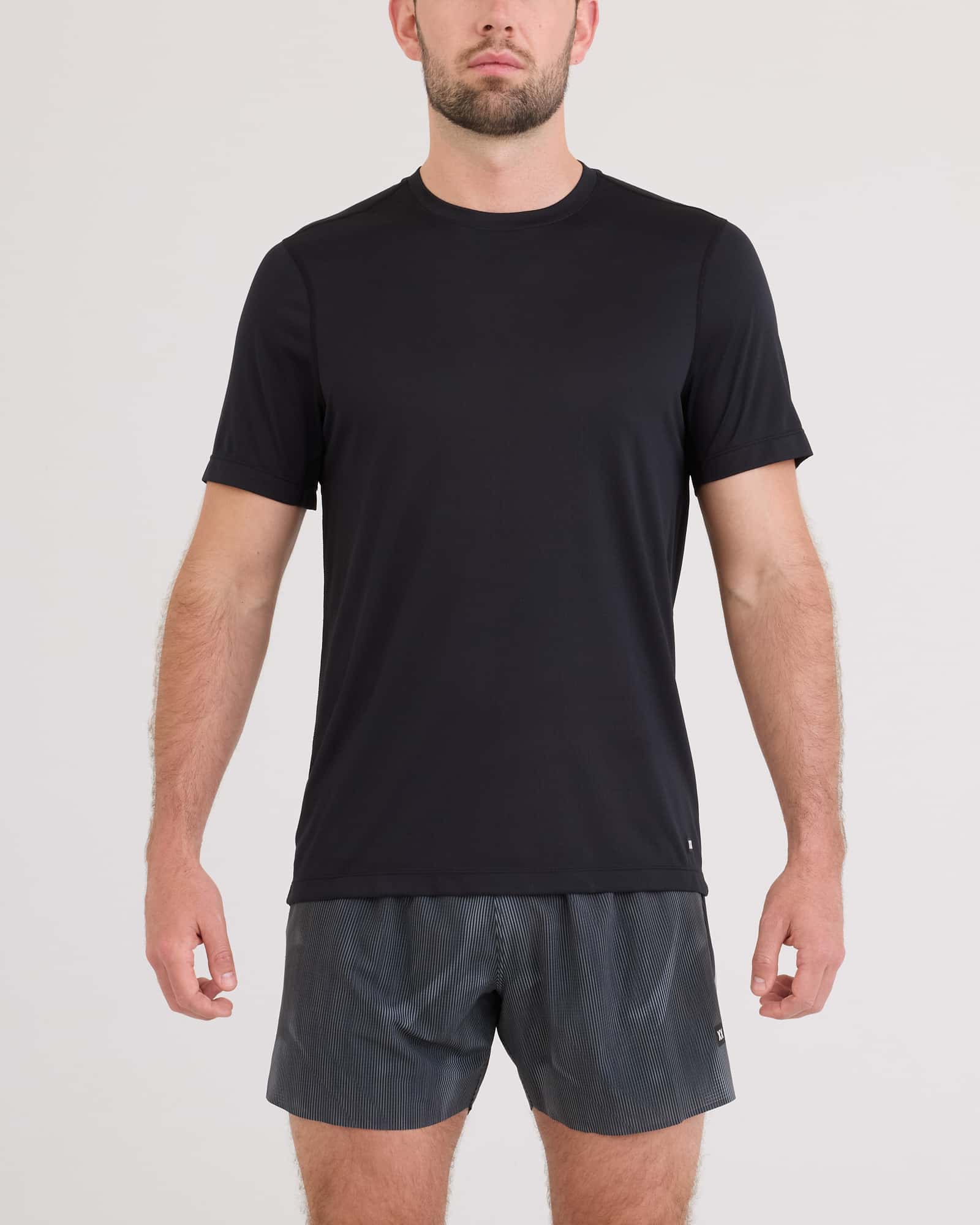 Front - Model wearing Multi-Sport Tech Tee in Black