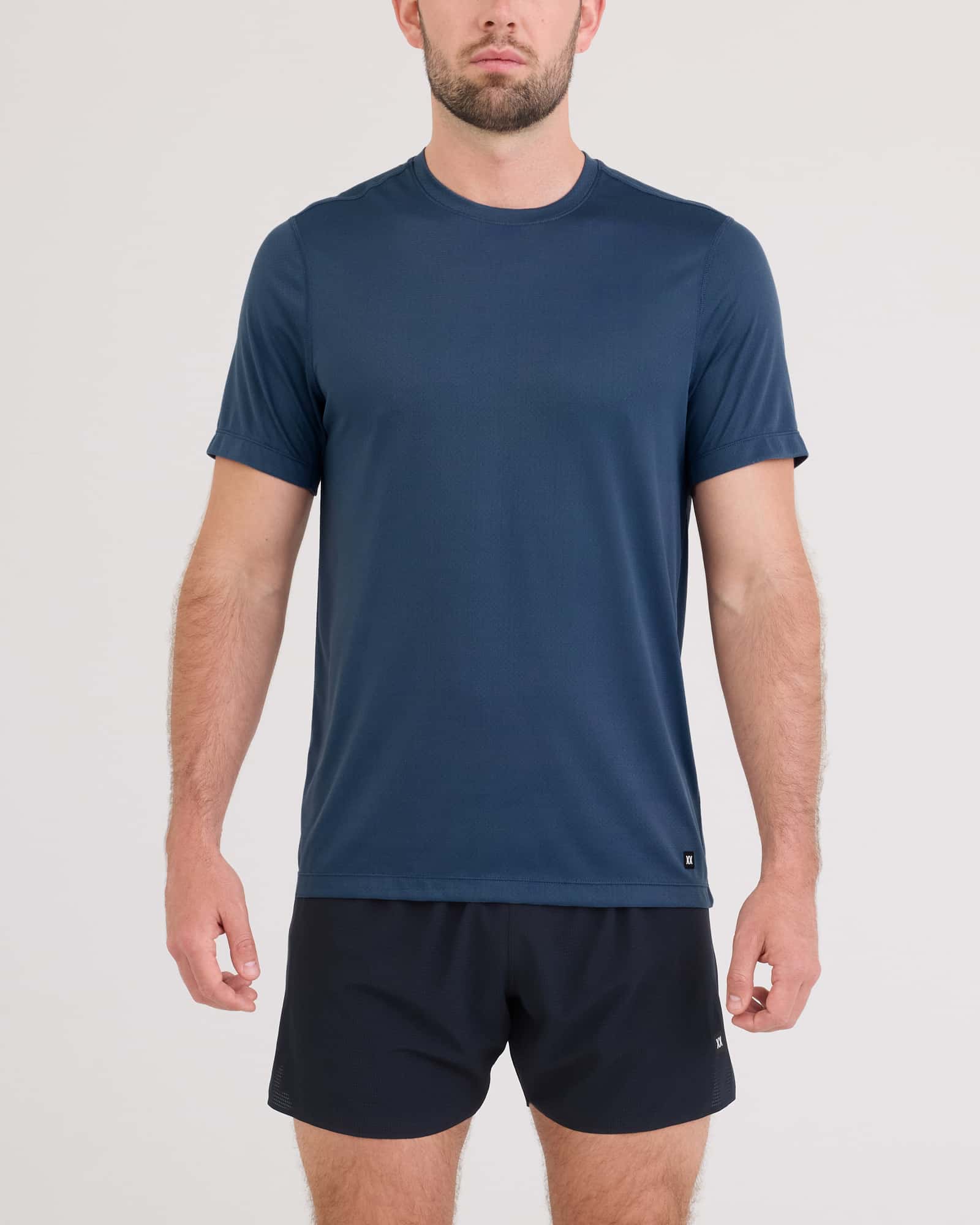 Front - Model wearing Multi-Sport Tech Tee in Washed Indigo