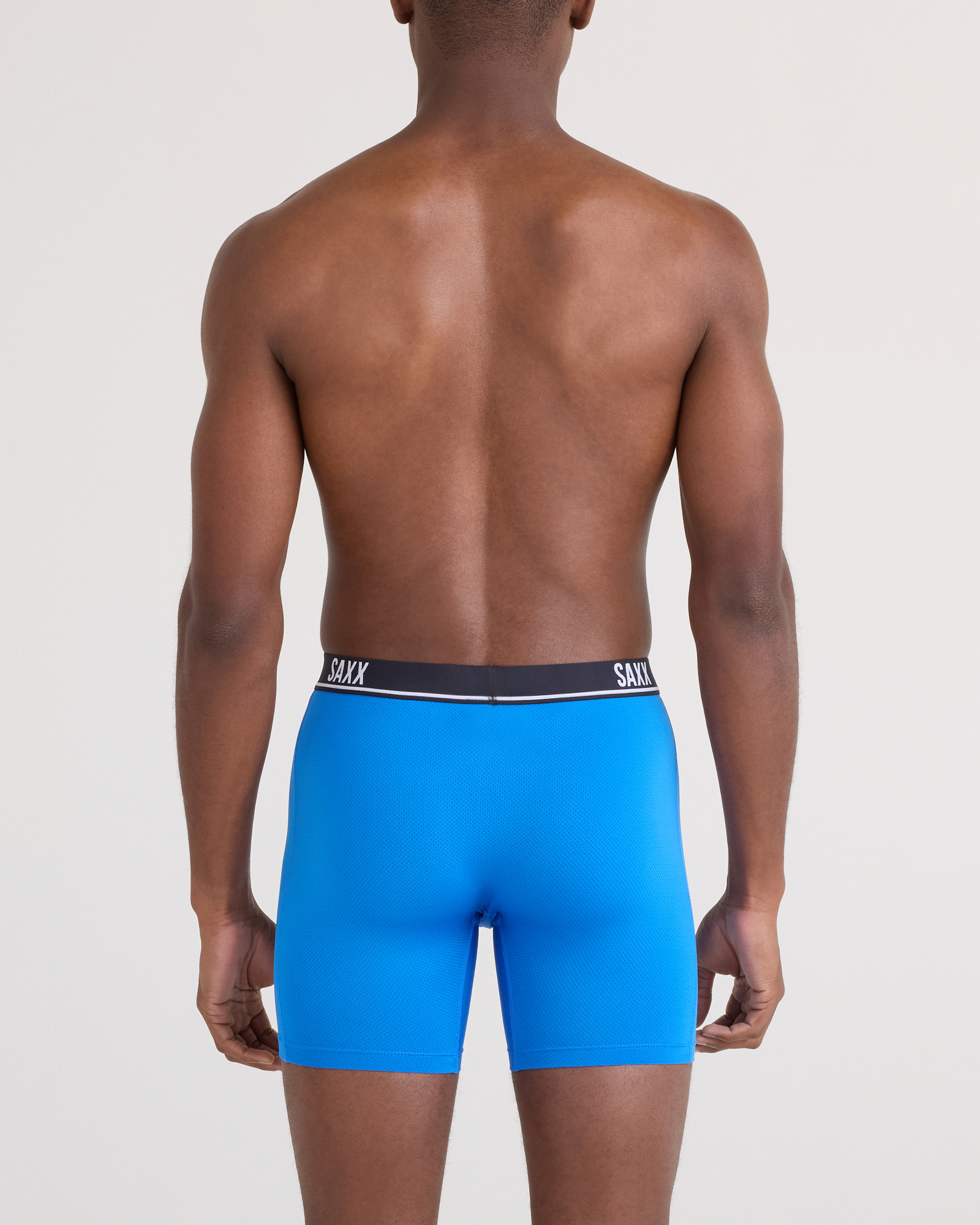 Back - Model posing in Essential Performance Mesh Boxer Brief in Blue/Teal/Maritime