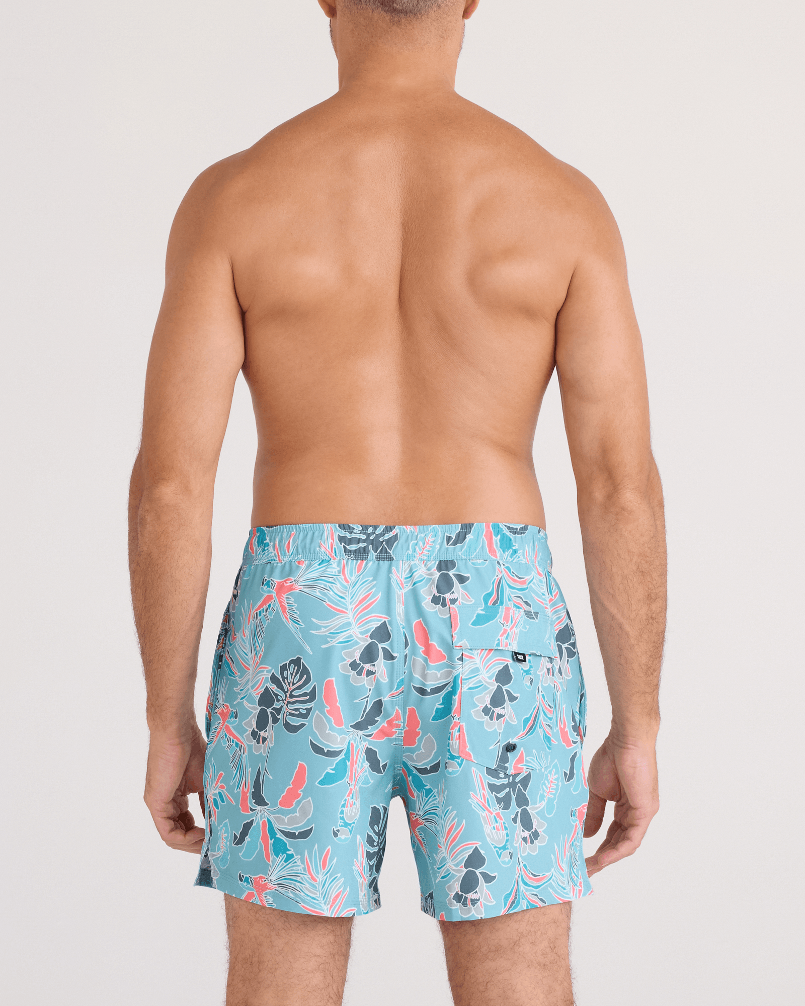 Back - Model wearing Oh Buoy 2N1 Swim Trunk 5" in Island Tropics-Blue Tide
