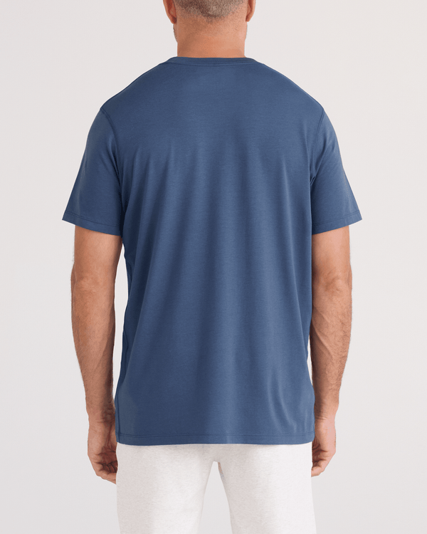 Back - Model wearing DropTemp Cooling Cotton Tee in Washed Indigo