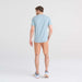 Back - Model wearing DropTemp Cooling Cotton Short Sleeve Crew in Clay Blue