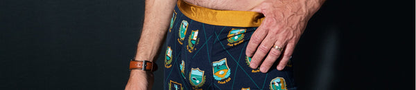 Man with thumb in waistband of silk underwear