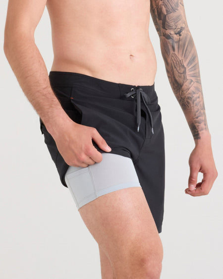 a man wearing shorts and a tattoo