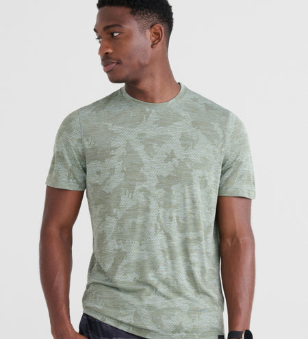 Man wearing a green active tee in camouflage print