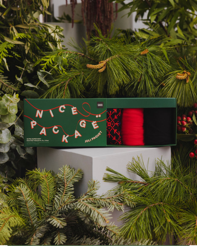 A close up image of a pair of underwear with gingerbread men playing golf printed on them.