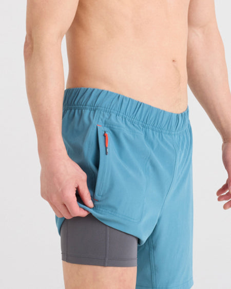 a man wearing blue shorts