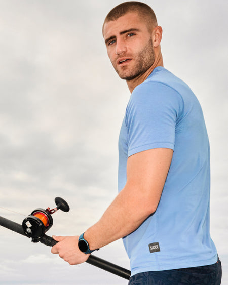 a man holding a fishing pole