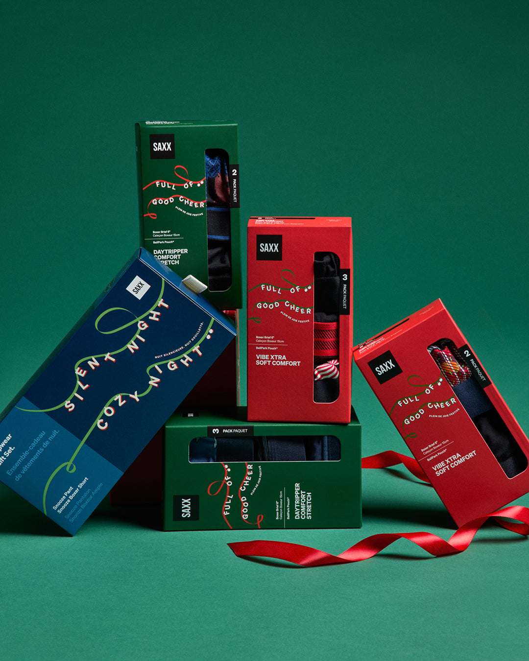 Collection of SAX product boxes on a green background