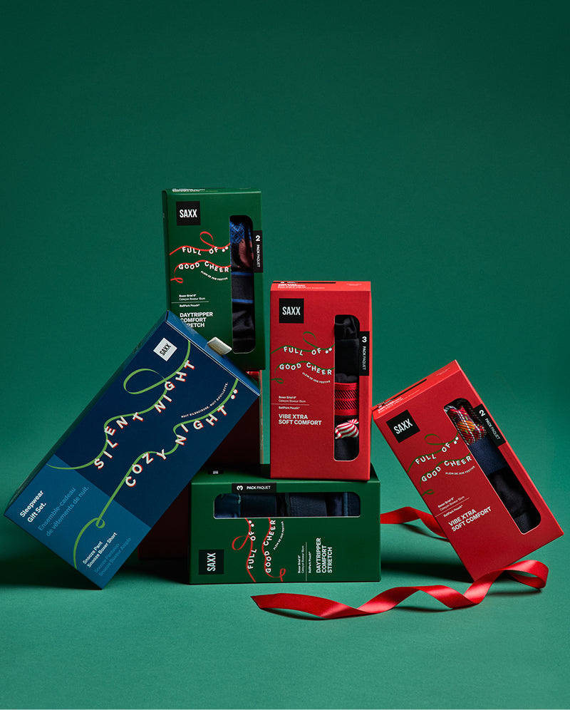 Collection of product packaging on a green background
