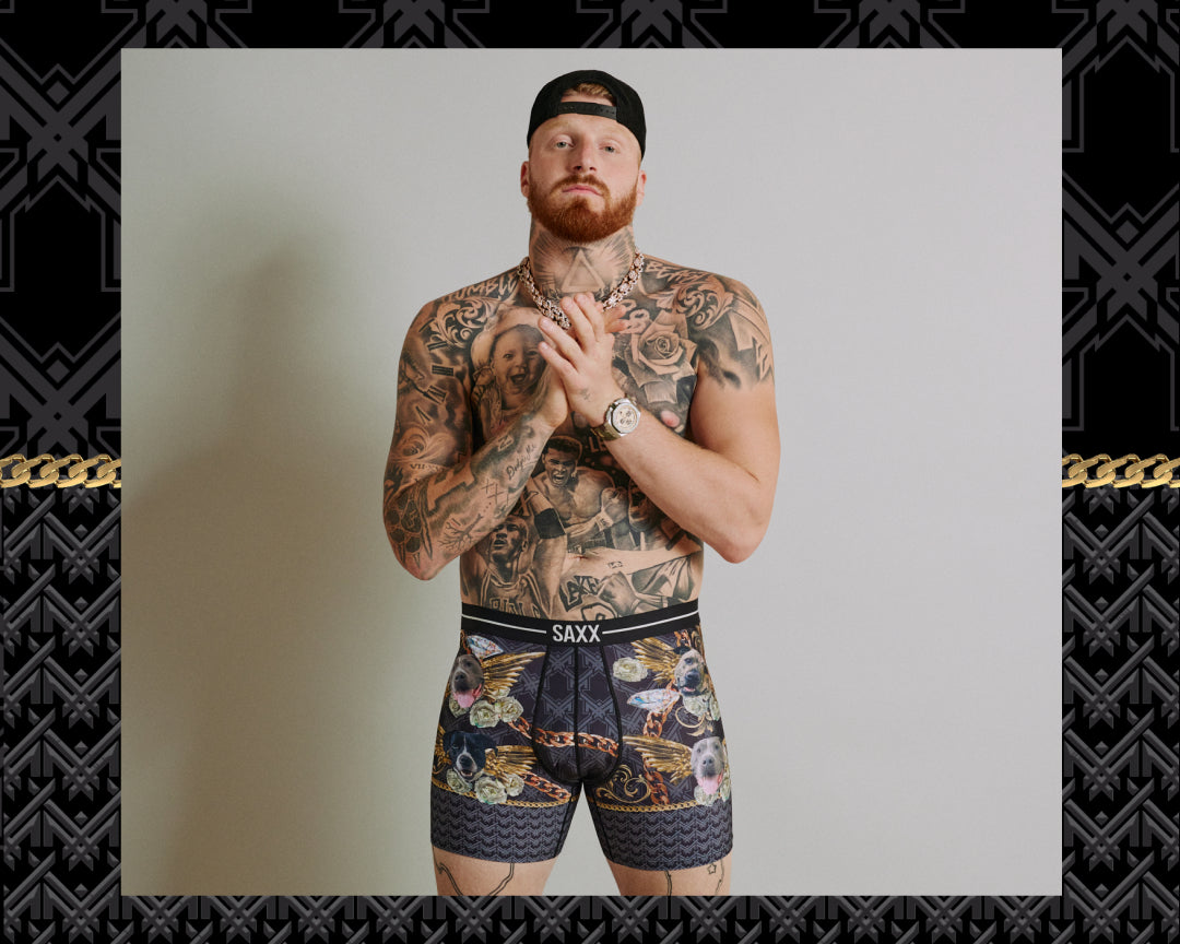 Man wearing SAXX underwear with a patterned design on a plain background