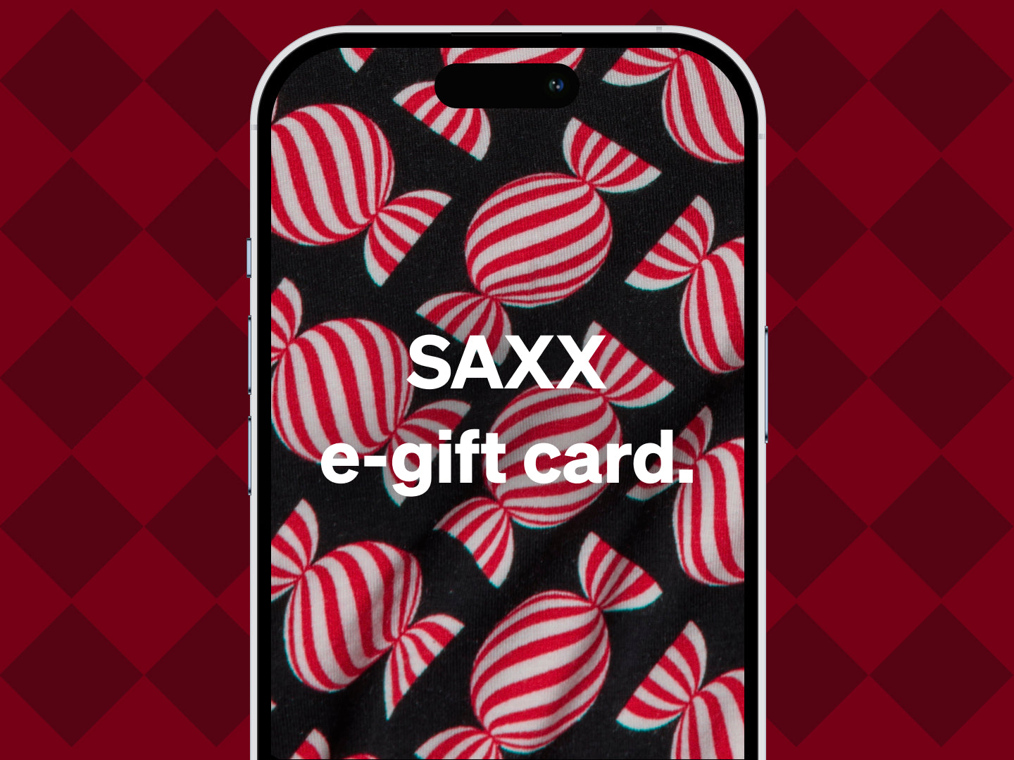 A smartphone showing a SAXX e-gift card on a background with red-and-white striped candies.