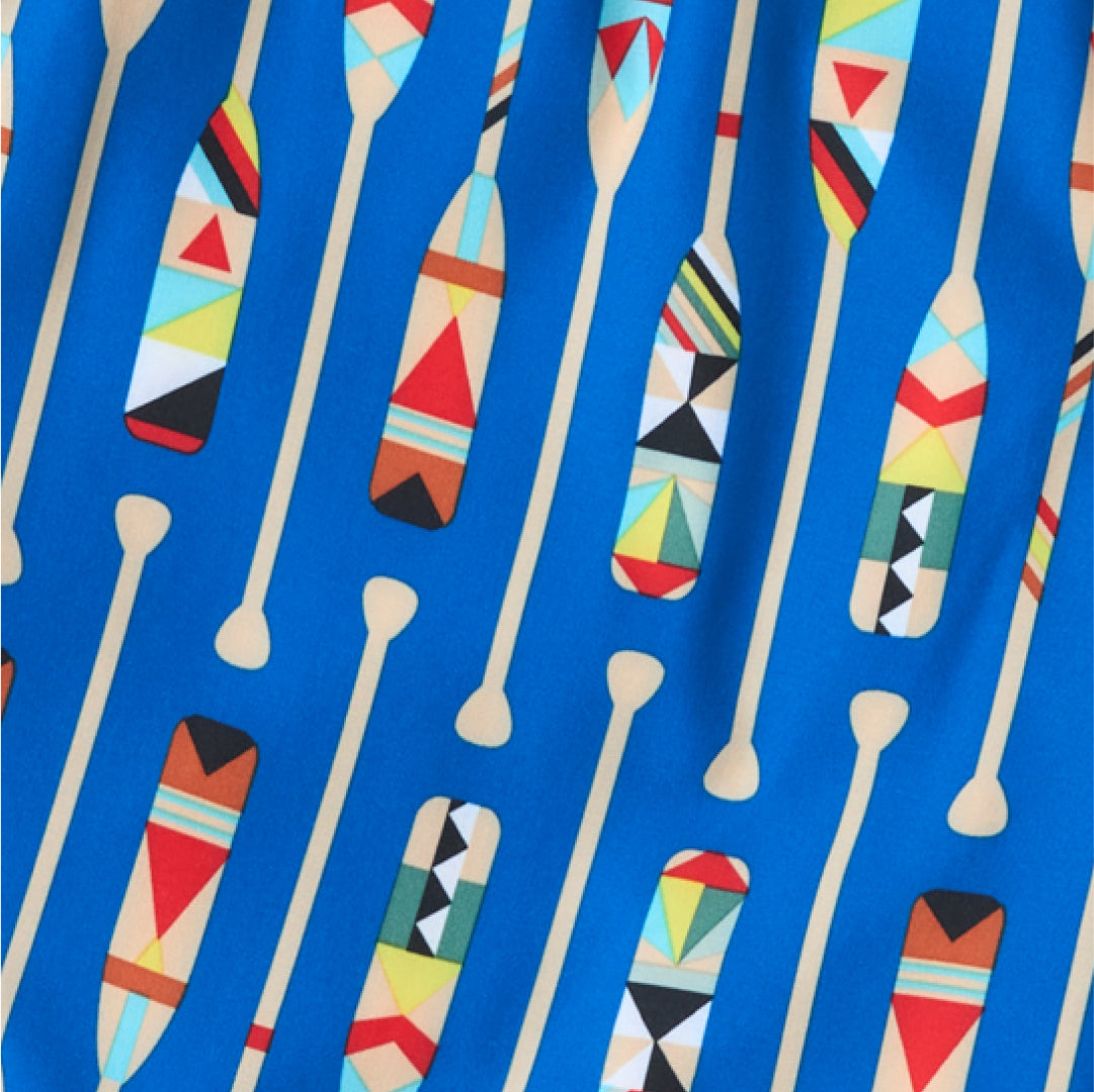 Closeup on blue SAXX Boxer Briefs showing detailed multi-color geometric-pattern canoe paddle print.