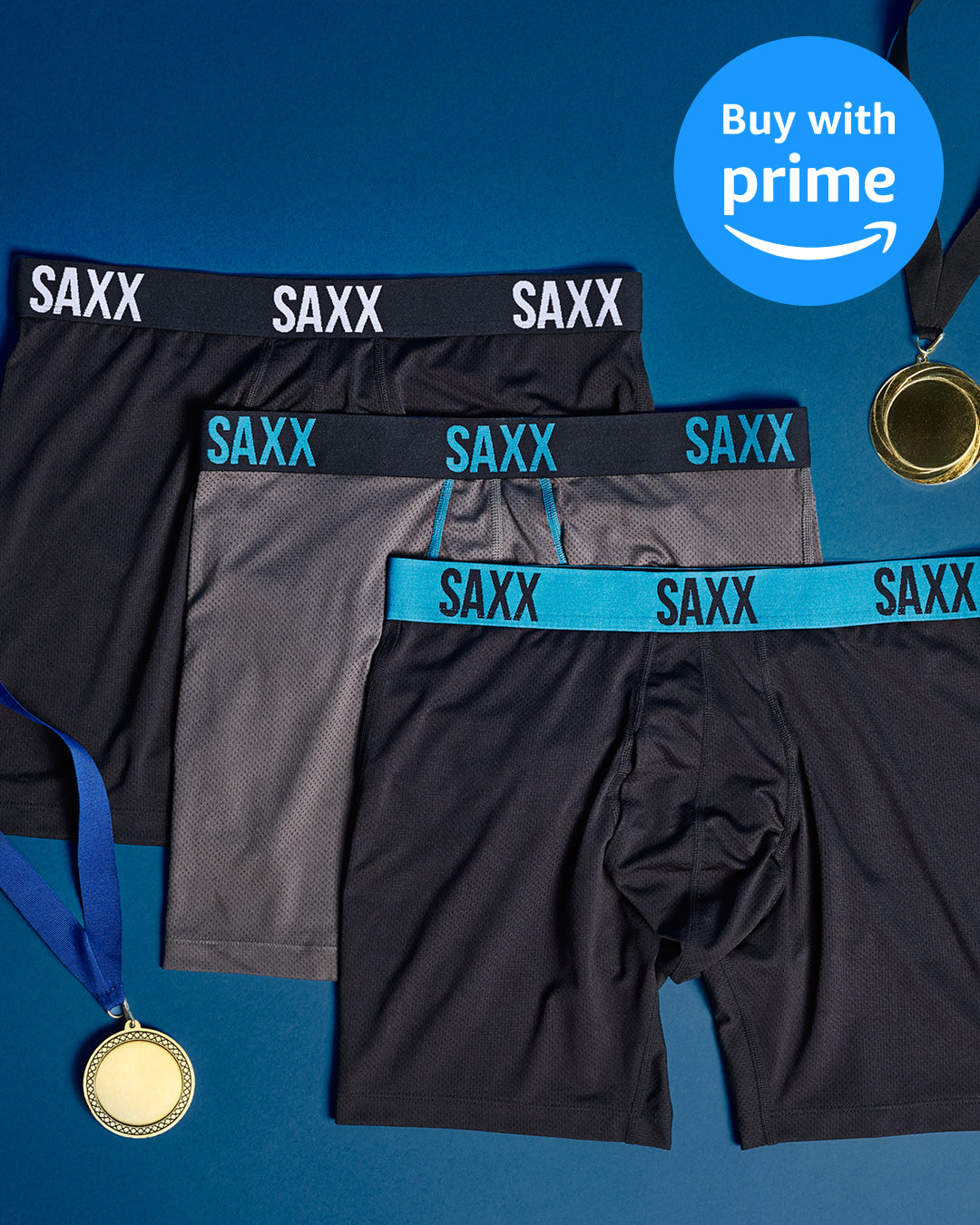Three pairs of SAXX underwear with visible branding on a blue background, featuring Amazon Prime logo.