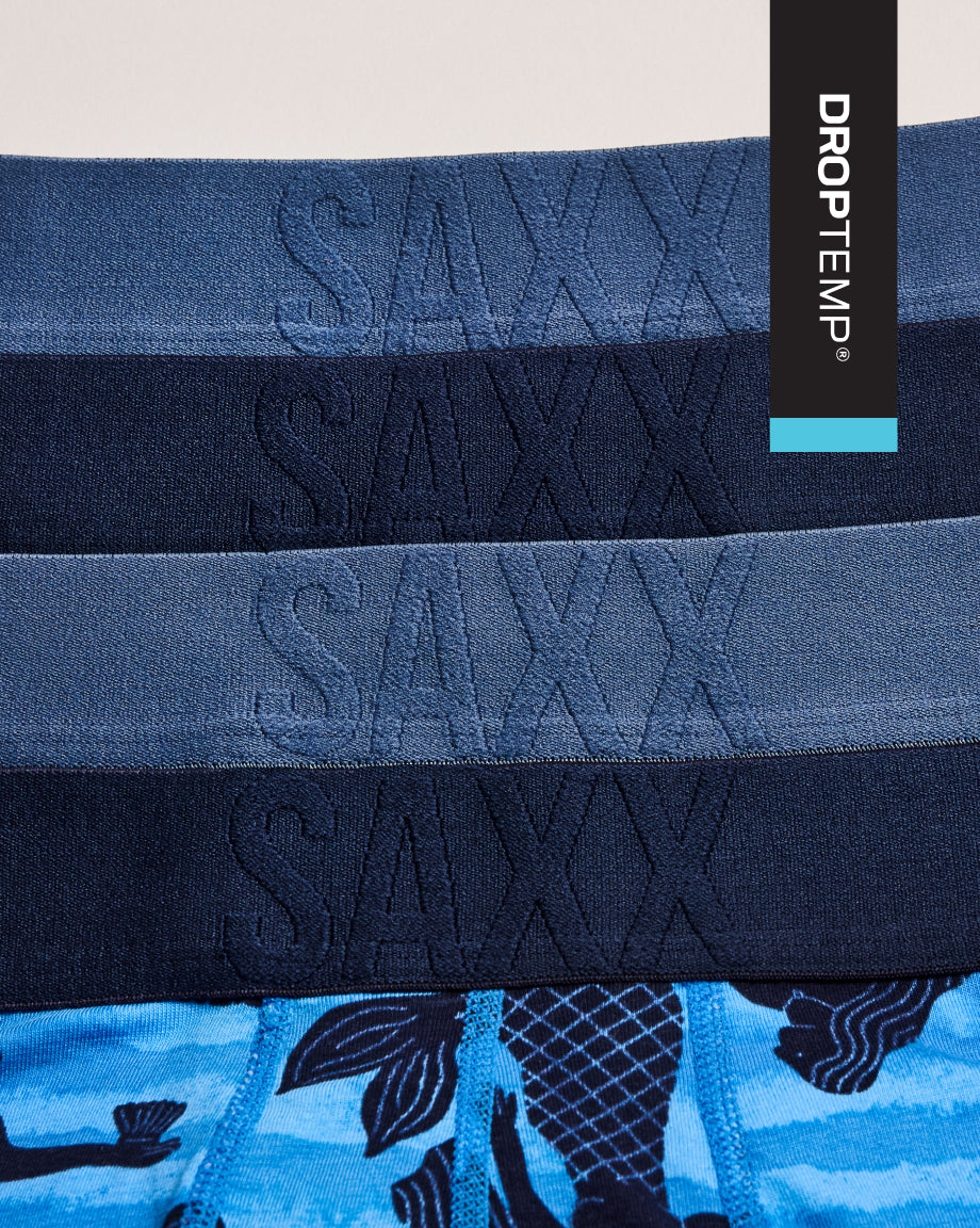Stack of SAXX underwear with 'Droptemp' branding on a light background