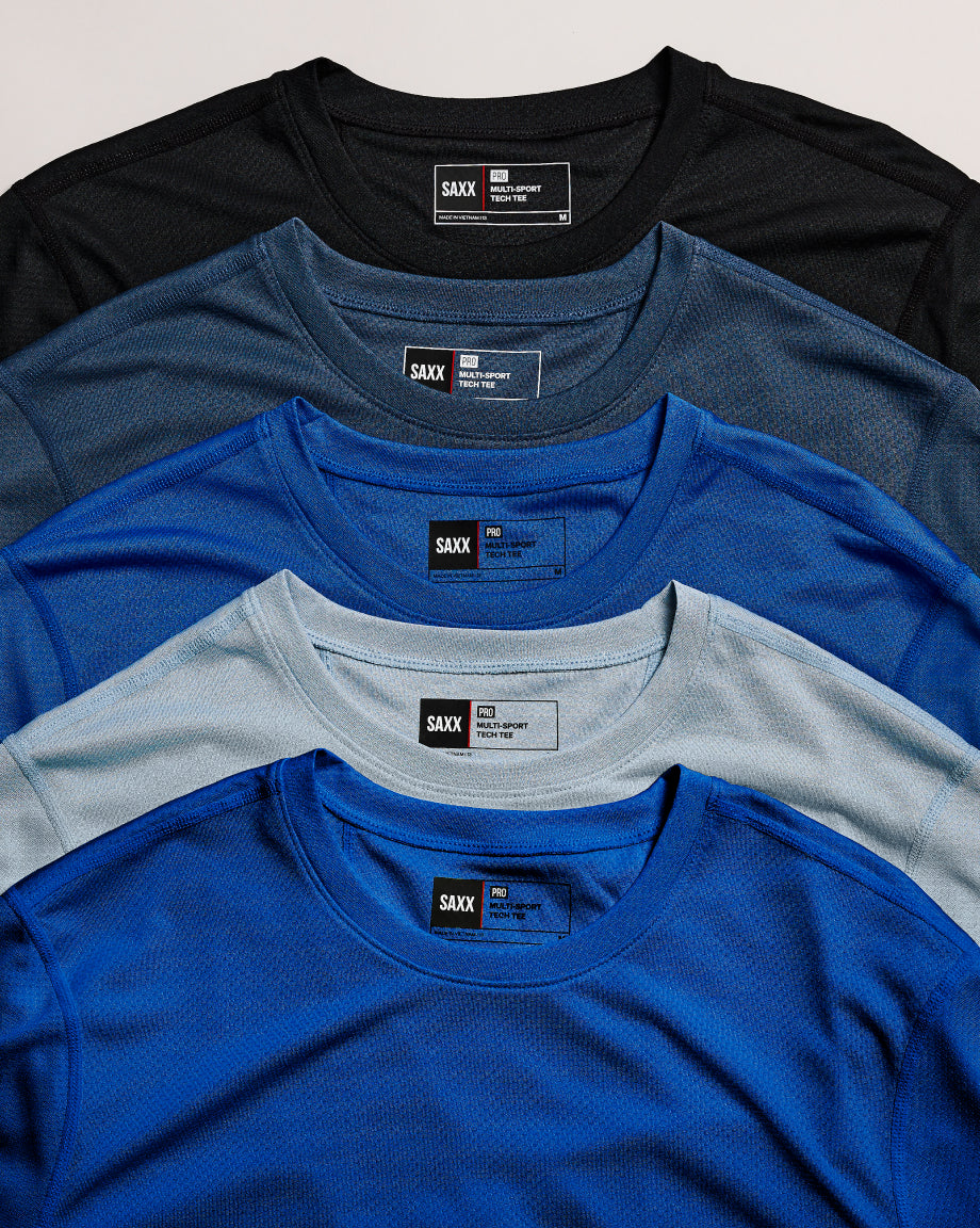 Five folded men's underwear shirts in black, blue, blue, gray, and blue with a brand label on a light gray background.