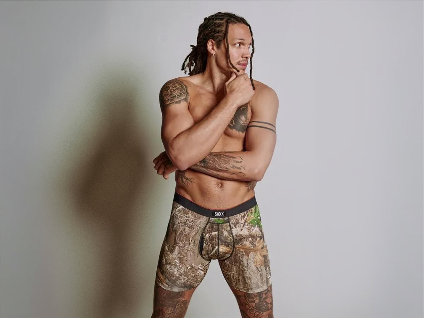 Pro Basketball Player and SAXX Gamechanger Aaron Gordon wearing Realtree® Multi-Sport Mesh underwear multipack featuring camo print and BallPark Pouch® support.