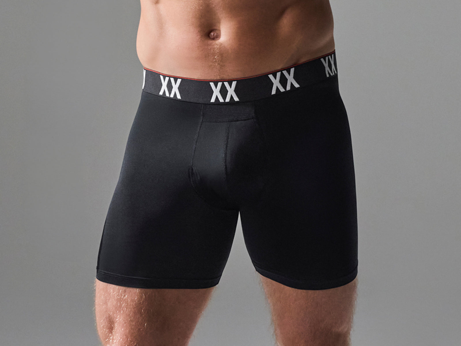 Man posing in SAXX Underwear Boxer Briefs