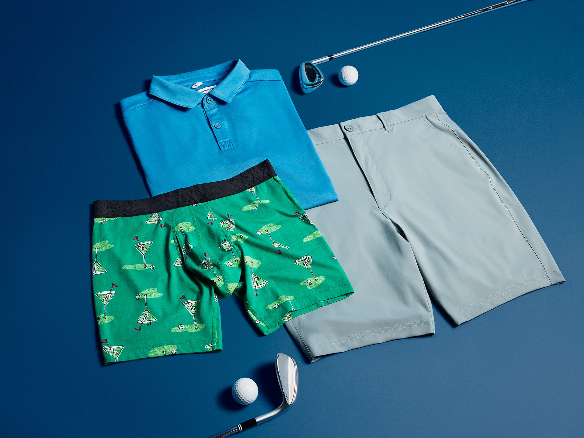 Golf-themed clothing and accessories on a blue background