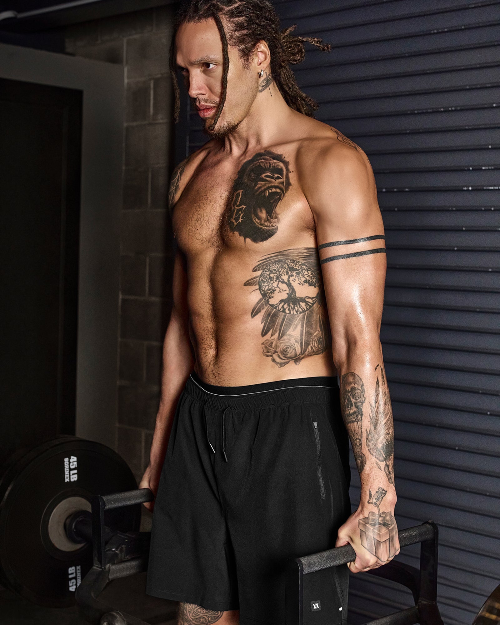 Aaron Gordon wearing black SAXX Power Moves shorts while lifting weights 
