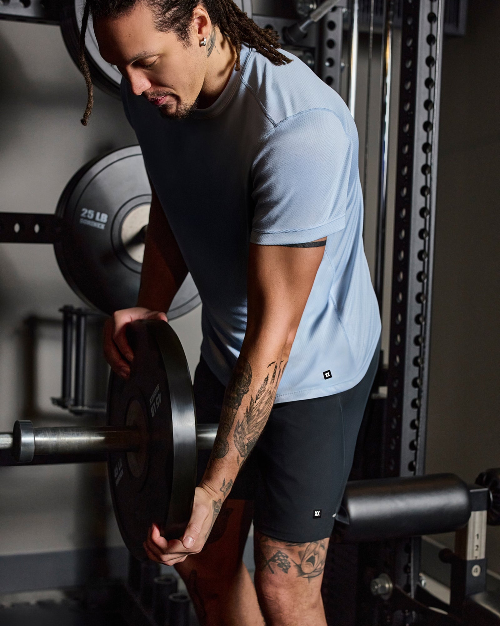 Aaron Gordon wearing a blue SAXX Multi-Sport Tee while in the gym