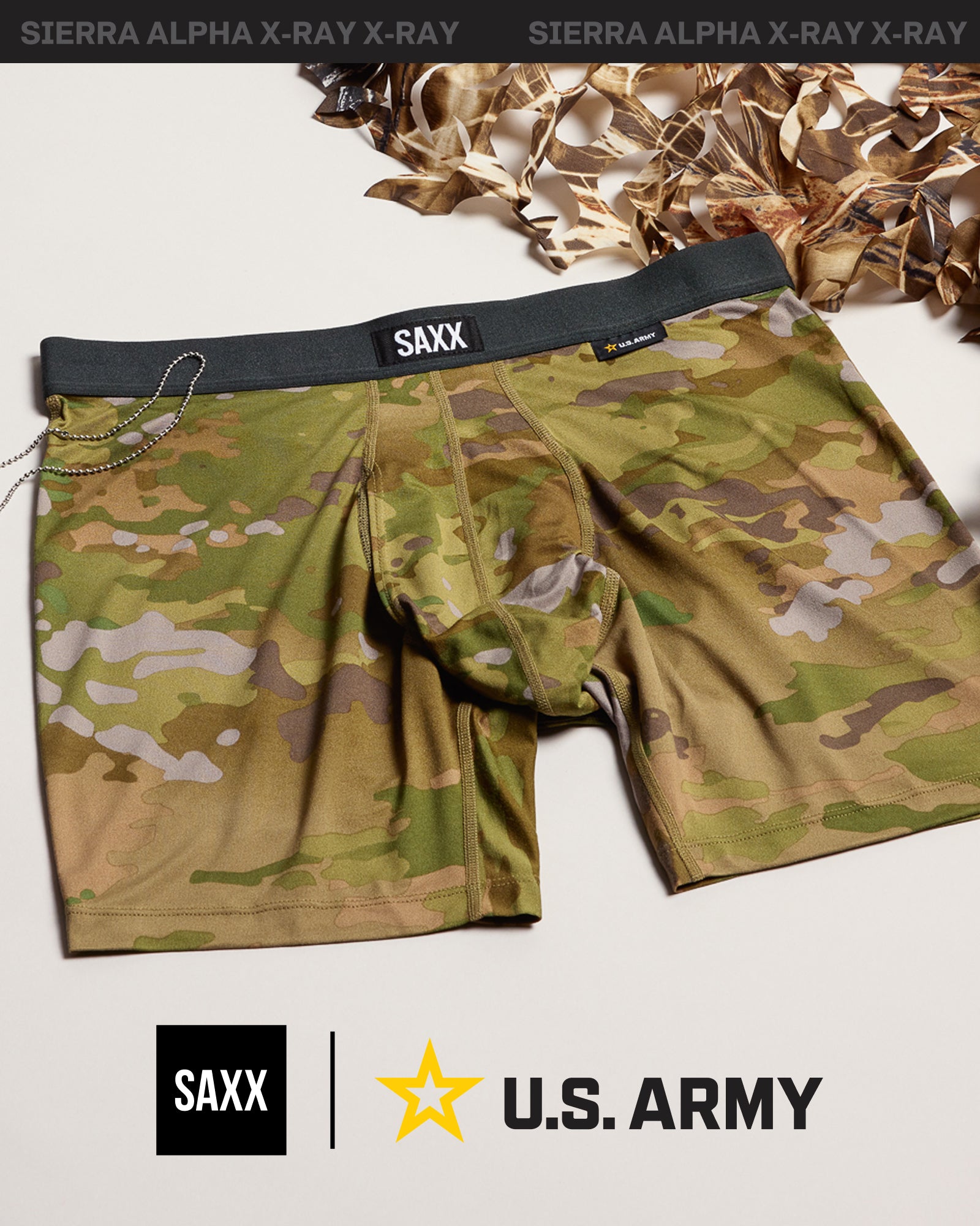 SAXX x U.S. Army graphic featuring a pair of camouflage boxer briefs  