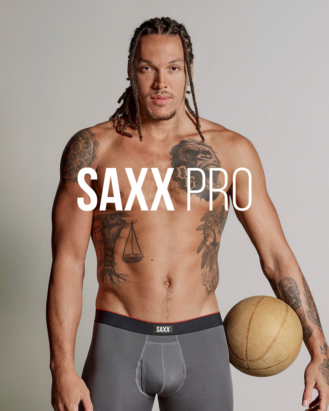 Pro basketball player Aaron Gordon wearing SAXX Pro underwear holding a basketball showcasing athletic fit support and performance design