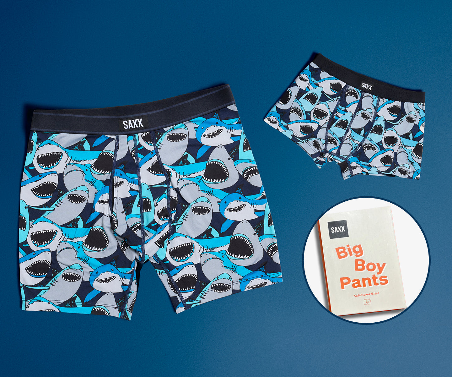 Shark-patterned boxer briefs with packaging on a blue background