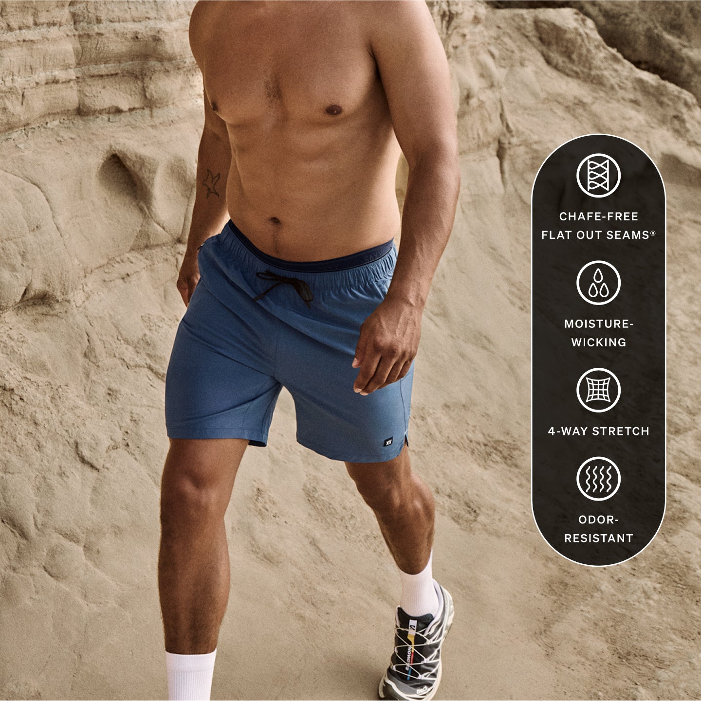 Man walking in blue shorts on beach with product tech features to the right