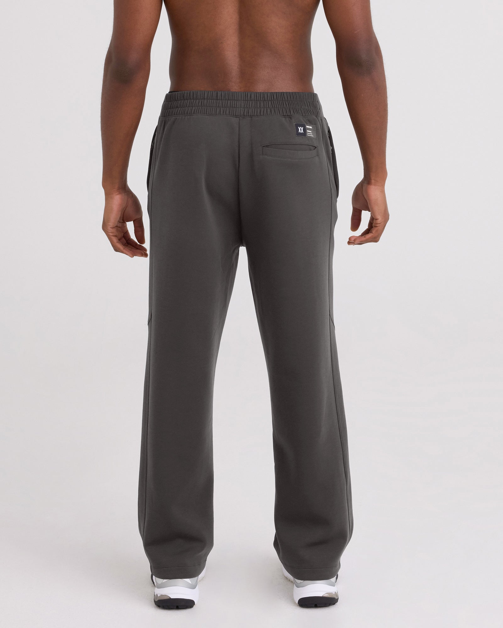 Back - Model wearing Phase Pants in Dark Grey
