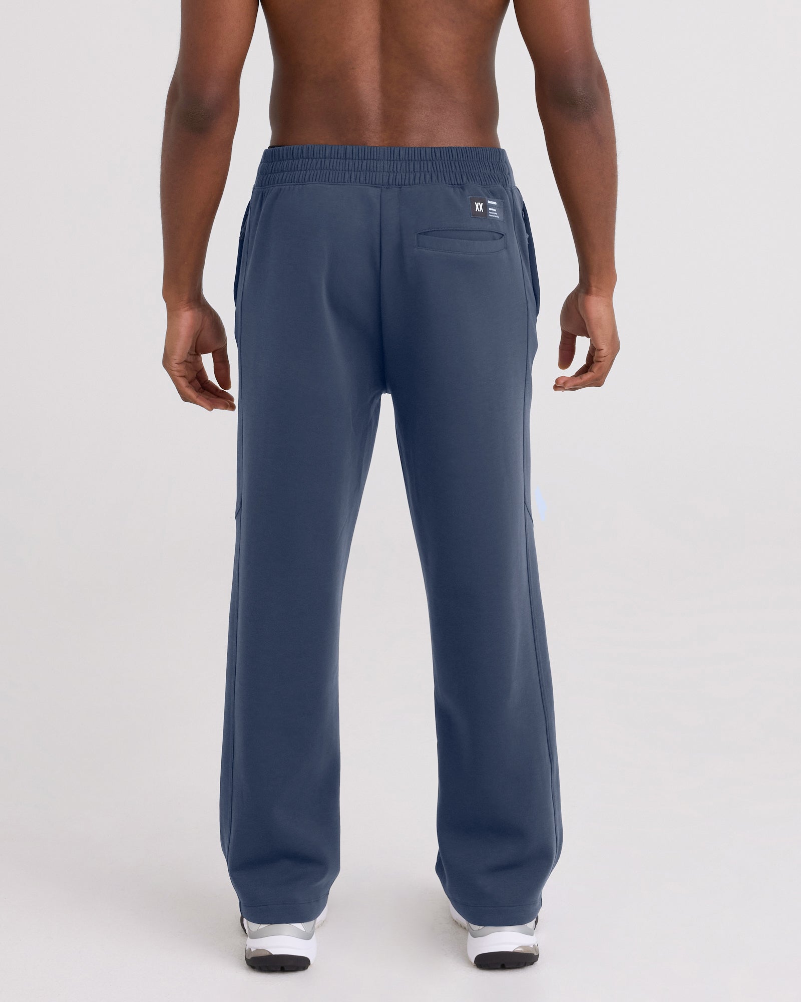 Back - Model wearing Phase Pants in Washed Indigo