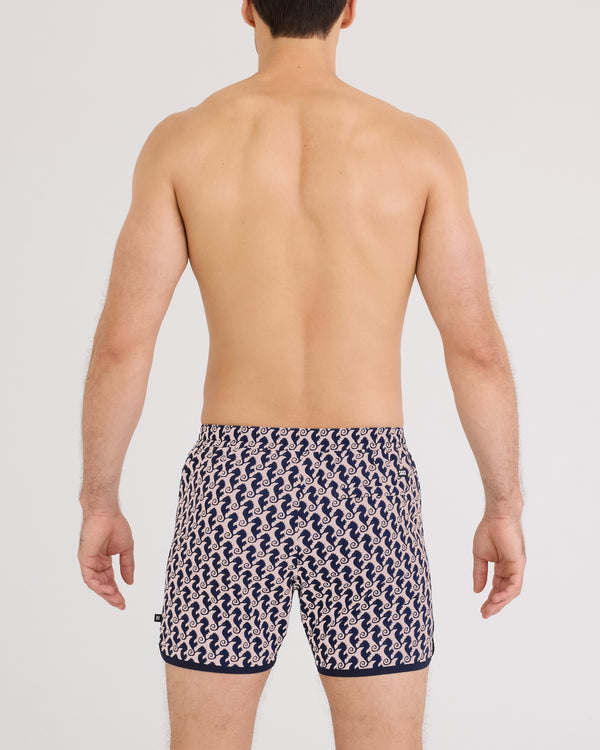 Back - Model wearing Harbormaster 2N1 Trunk 5" in Seahorse Chain-Light Coral