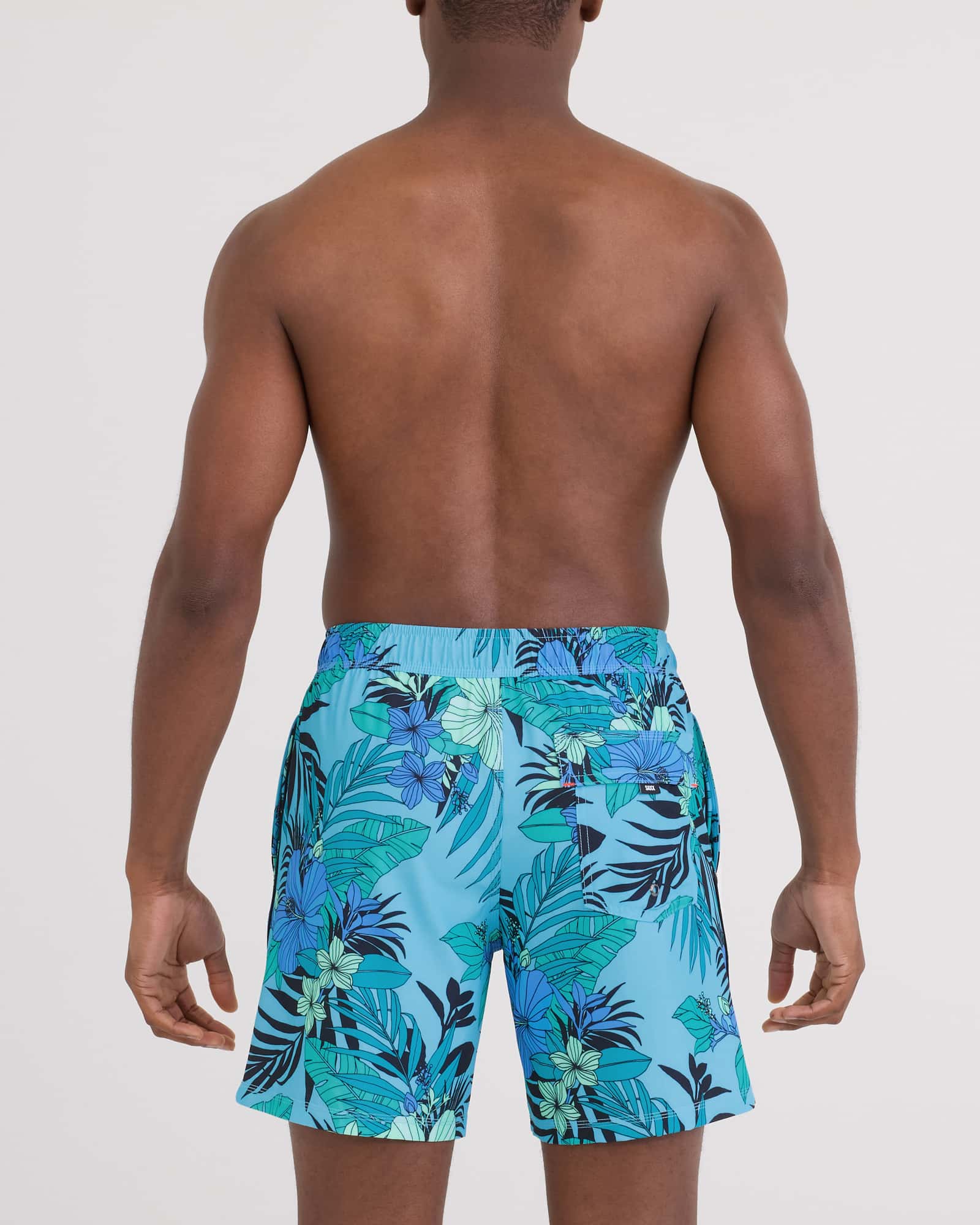 Back - Model wearing Oh Buoy 2N1 Volley - Brief Liner 7" in Hibiscus Jungle-Blue